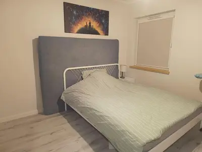 Łóżko lub łóżka w pokoju w obiekcie Apartament pod Złotym Bocianem