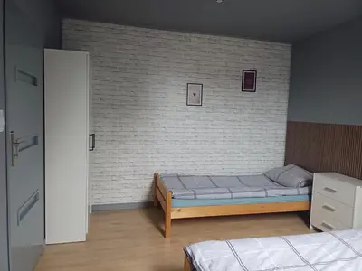 Łóżko lub łóżka w pokoju w obiekcie Sunny Grey