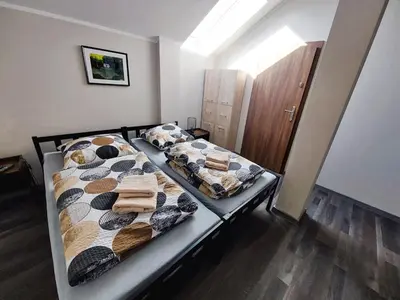 Łóżko lub łóżka w pokoju w obiekcie AE BERG Apartamenty