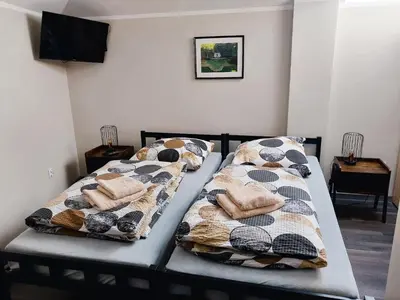 Łóżko lub łóżka w pokoju w obiekcie AE BERG Apartamenty