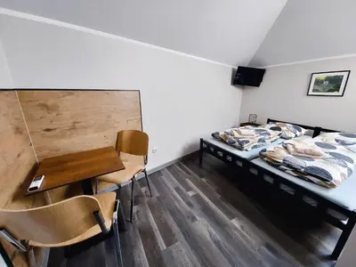 Łóżko lub łóżka w pokoju w obiekcie AE BERG Apartamenty