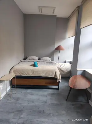 Łóżko lub łóżka w pokoju w obiekcie Apartament Grey