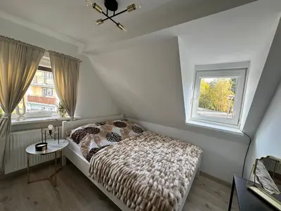 Łóżko lub łóżka w pokoju w obiekcie LimeHouse Apartament