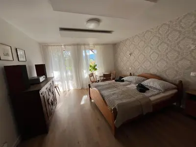 Łóżko lub łóżka w pokoju w obiekcie Apartament Parkowy