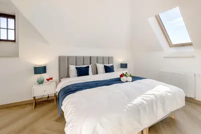 Łóżko lub łóżka w pokoju w obiekcie Sonata Apartments