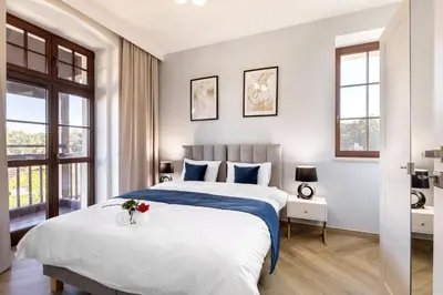 Łóżko lub łóżka w pokoju w obiekcie Sonata Apartments