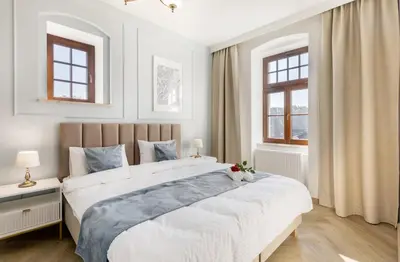Łóżko lub łóżka w pokoju w obiekcie Sonata Apartments