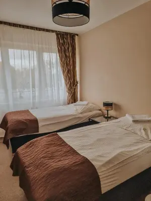Łóżko lub łóżka w pokoju w obiekcie Pokoje hotelowe Azyl