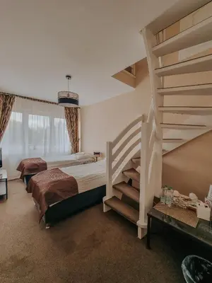 Łóżko lub łóżka w pokoju w obiekcie Pokoje hotelowe Azyl
