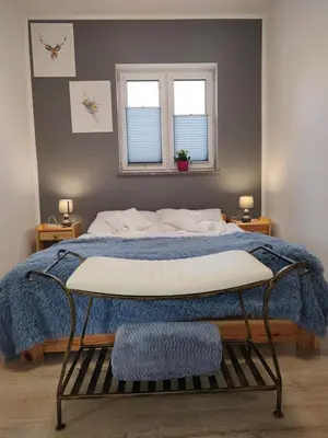 Łóżko lub łóżka w pokoju w obiekcie Apartamenty Pod Gruszą