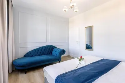 Łóżko lub łóżka w pokoju w obiekcie Vestium Apartment