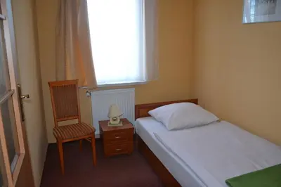 Łóżko lub łóżka w pokoju w obiekcie Hotelik Orlik