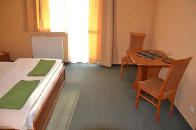 Łóżko lub łóżka w pokoju w obiekcie Hotelik Orlik