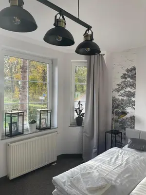 Łóżko lub łóżka w pokoju w obiekcie Apartamenty Przy Potoku