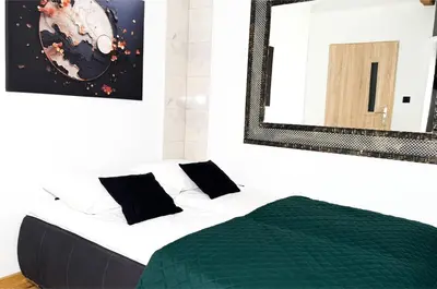 Łóżko lub łóżka w pokoju w obiekcie Apartament Kościuszki 2 by LibertaRent