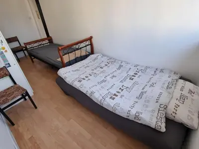Łóżko lub łóżka w pokoju w obiekcie Konkrety Lubin