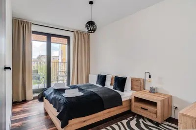 Łóżko lub łóżka w pokoju w obiekcie Wyszyńskiego 56 by Homeprime