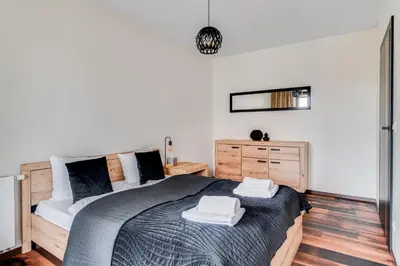 Łóżko lub łóżka w pokoju w obiekcie Wyszyńskiego 56 by Homeprime