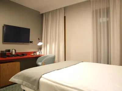 Łóżko lub łóżka w pokoju w obiekcie Gvarna Apartamenty