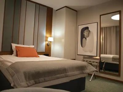 Łóżko lub łóżka w pokoju w obiekcie Gvarna Apartamenty