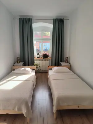 Łóżko lub łóżka w pokoju w obiekcie Apartament pod Wieżą Srebrna Góra