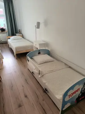 Łóżko lub łóżka w pokoju w obiekcie Apartament pod Wieżą Srebrna Góra