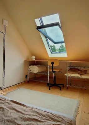 Łóżko lub łóżka w pokoju w obiekcie Zielanka - Cabin in Owl Mountains