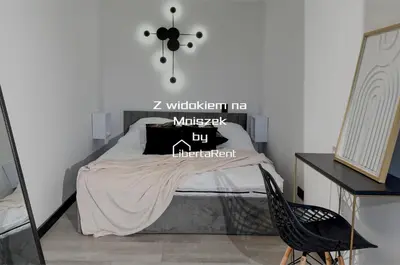 Łóżko lub łóżka w pokoju w obiekcie Z widokiem na Mniszek by LibertaRent