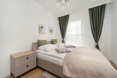 Łóżko lub łóżka w pokoju w obiekcie Stylowy Apartament z Widokiem Browary Wrocławskie by Renters Prestige