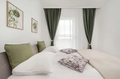 Łóżko lub łóżka w pokoju w obiekcie Stylowy Apartament z Widokiem Browary Wrocławskie by Renters Prestige