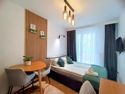 Łóżko lub łóżka w pokoju w obiekcie AmaMolto Select - włoskie apartamenty, bezpłatny parking