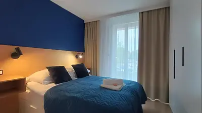 Łóżko lub łóżka w pokoju w obiekcie AmaMolto Select - włoskie apartamenty, bezpłatny parking