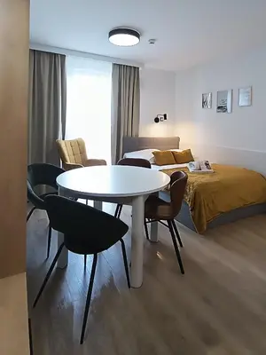 Łóżko lub łóżka w pokoju w obiekcie AmaMolto Select - włoskie apartamenty, bezpłatny parking