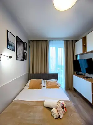 Łóżko lub łóżka w pokoju w obiekcie AmaMolto Select - włoskie apartamenty, bezpłatny parking