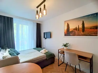 Łóżko lub łóżka w pokoju w obiekcie AmaMolto Select - włoskie apartamenty, bezpłatny parking