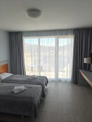 Łóżko lub łóżka w pokoju w obiekcie Apartament MERCURY