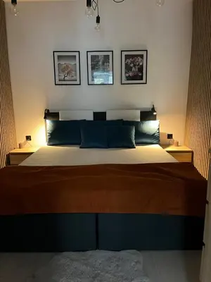 Łóżko lub łóżka w pokoju w obiekcie Apartament Pod Magnolią
