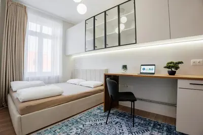 Łóżko lub łóżka w pokoju w obiekcie K26UrbanNest