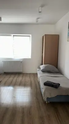 Łóżko lub łóżka w pokoju w obiekcie Apartamenty Ścinawa
