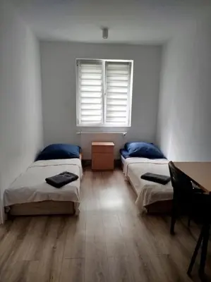 Łóżko lub łóżka w pokoju w obiekcie Apartamenty Ścinawa