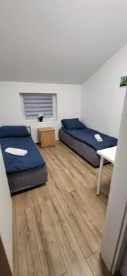 Łóżko lub łóżka w pokoju w obiekcie Apartamenty Ścinawa
