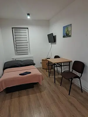 Łóżko lub łóżka w pokoju w obiekcie Apartamenty Ścinawa