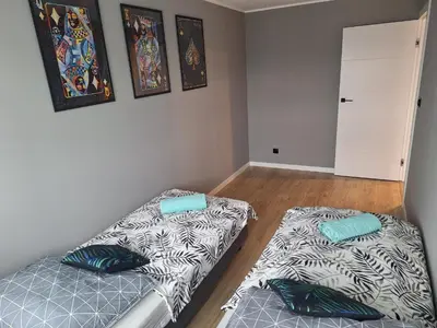 Łóżko lub łóżka w pokoju w obiekcie Komfortowy apartament dla 7 osób CH Arena, prywatny parking