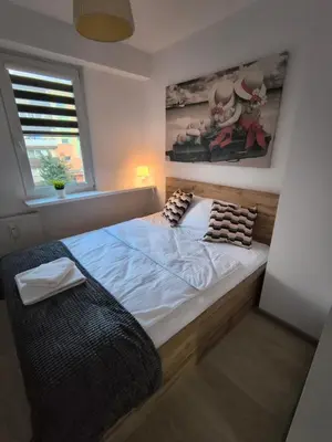 Łóżko lub łóżka w pokoju w obiekcie Tabago Studio 30 Wieluń Stare Sady