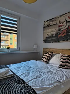 Łóżko lub łóżka w pokoju w obiekcie Tabago Studio 30 Wieluń Stare Sady