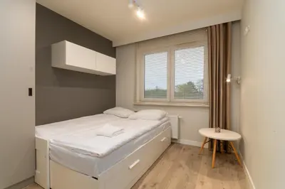 Łóżko lub łóżka w pokoju w obiekcie Wichrowa Deluxe Apartment by BookingHost