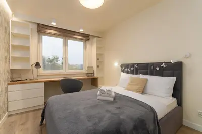 Łóżko lub łóżka w pokoju w obiekcie Wichrowa Deluxe Apartment by BookingHost
