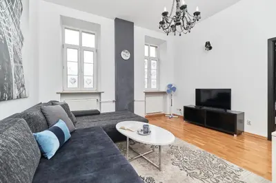 Telewizja i/lub zestaw kina domowego w obiekcie Rynek Apartment The Heart of the City by Noclegi Renters