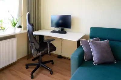 Telewizja i/lub zestaw kina domowego w obiekcie Zielony apartament w centrum