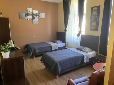 Łóżko lub łóżka w pokoju w obiekcie Hotel Sportowy
